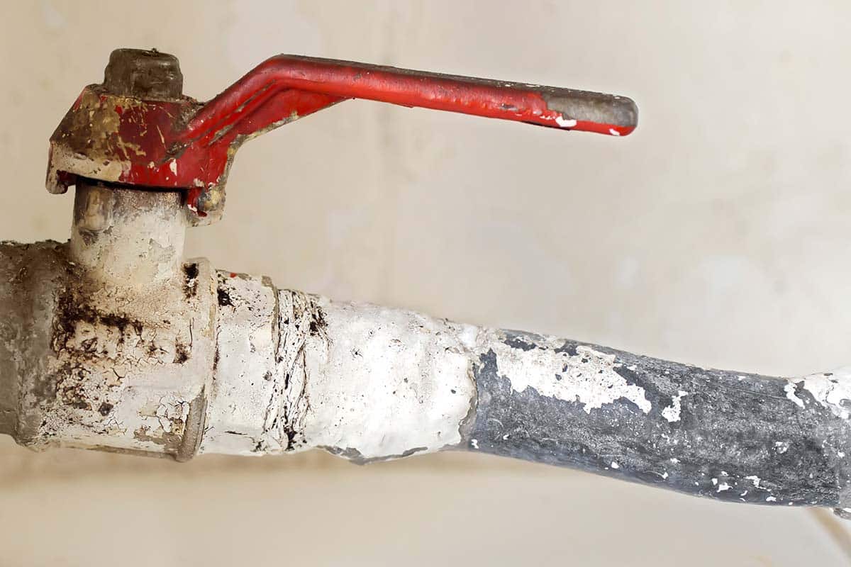 Older corroded pipe and valve associated with lead plumbing