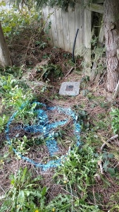 Utility access point uncovered during underground water leak repair