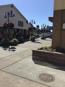 Commercial sidewalk area where the hidden underground water pipe leak was located