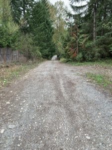 Gravel driveway along the 500-foot underground water service line