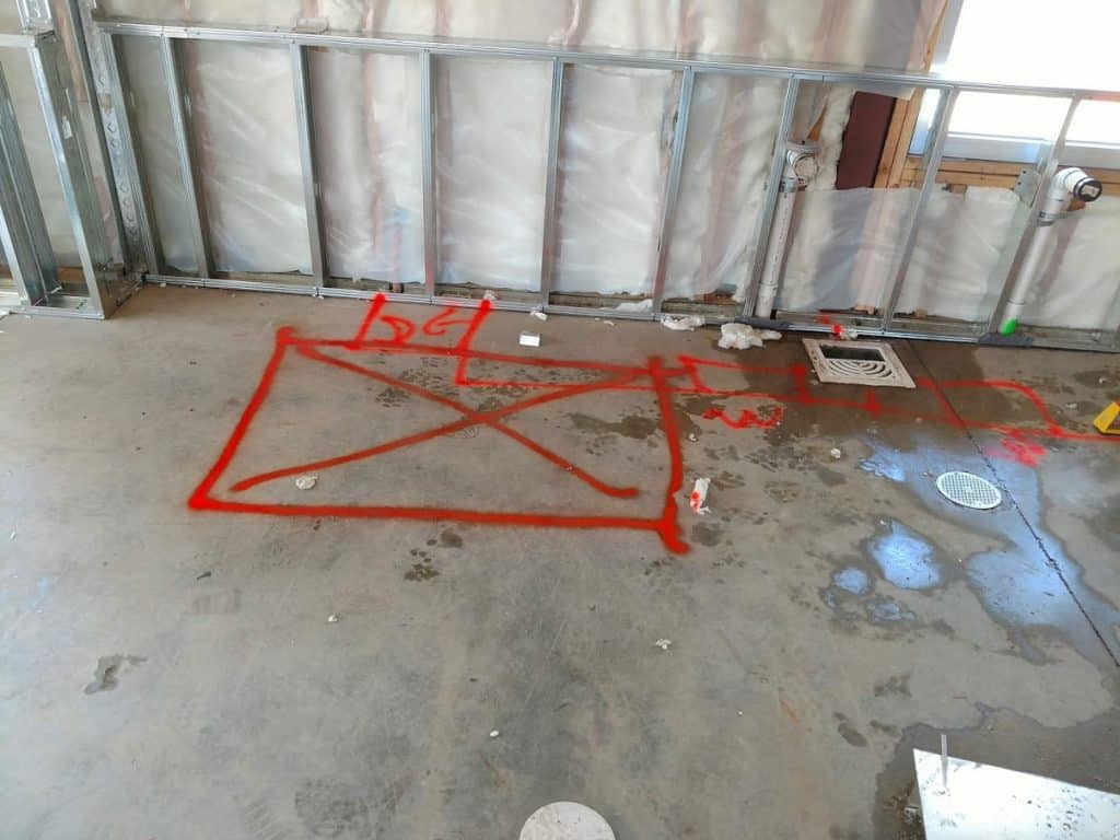 First leak area marked on the building slab floor