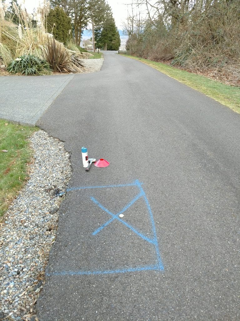 Long private road with the underground water leak location marked