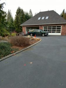 Service truck and equipment set up at a house detached garage