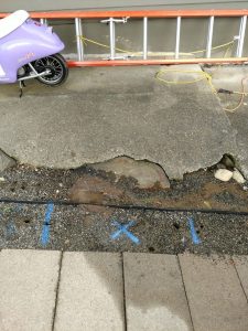 Leak area marked between two homes for a spot repair