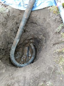 Water pipe exposed in a trench and ready for a spot repair