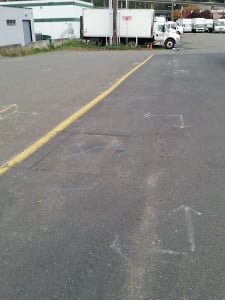 Seattle commercial water line repair area marked for a spot repair