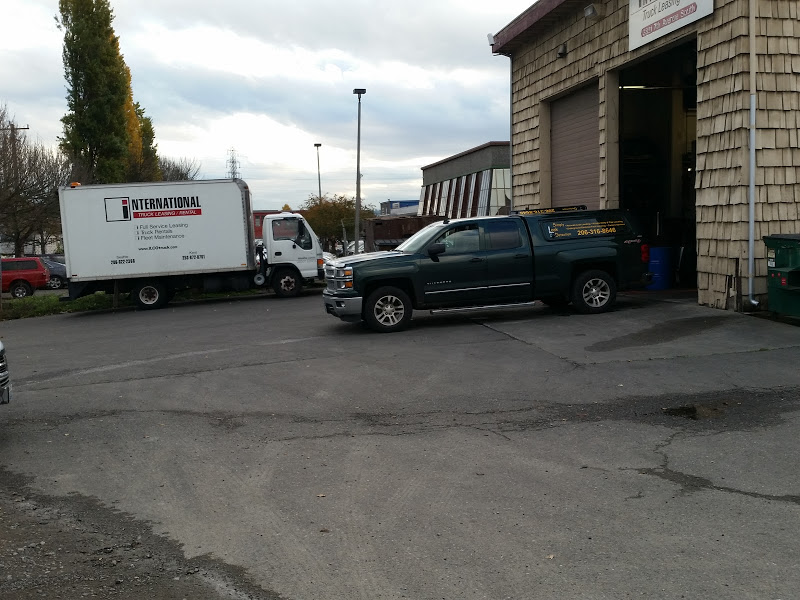 Seattle commercial property with a leak detection service truck outside
